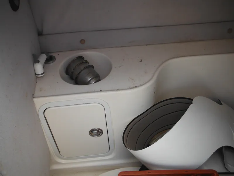 Slide: The Image of 2007 Hurricane SD 237 boat interior with sink and storage compartment. - 26