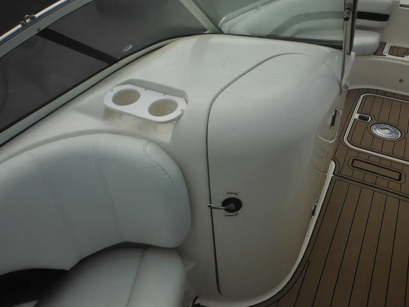 Slide: The Image of 2007 Hurricane SD 237 boat interior with white seating and cup holders. - 27