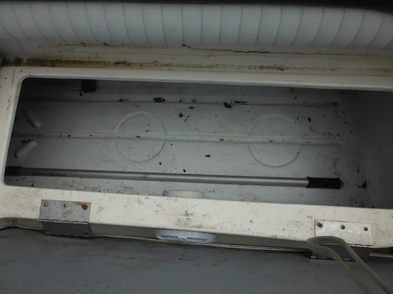 Slide: The Image of Open storage compartment in a 2007 Hurricane SD 237 boat, showing interior details. - 34