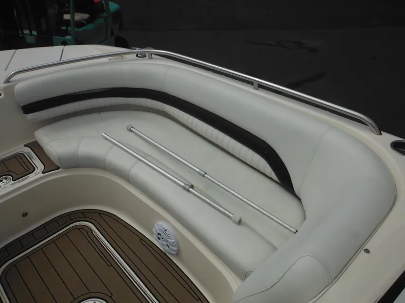 Slide: The Image of 2007 Hurricane SD 237 boat interior with white seating and wood-patterned flooring. - 39