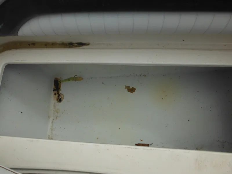 Slide: The Image of 2007 Hurricane SD 237 boat compartment with visible rust and debris. - 43