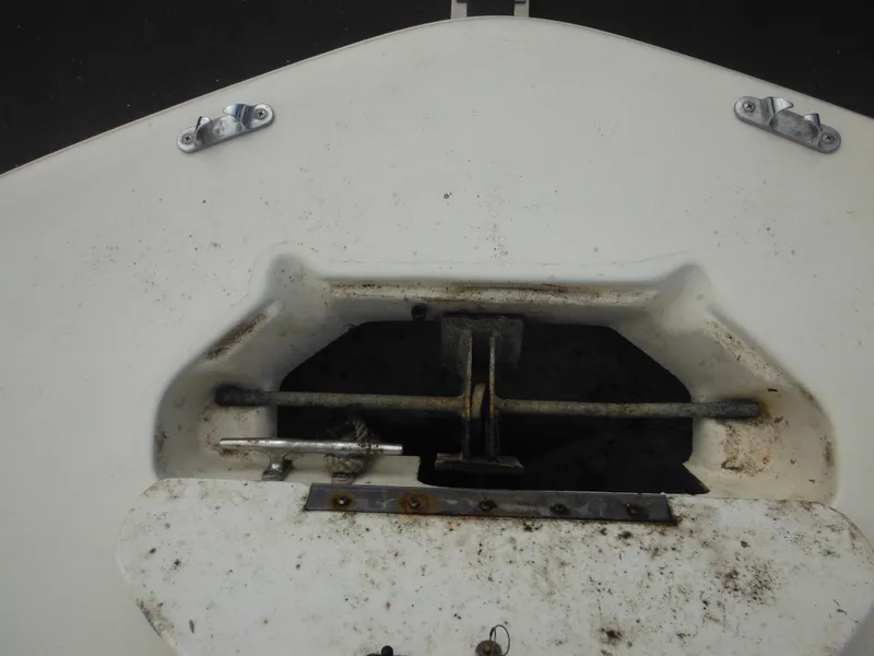 Slide: The Image of 2007 Hurricane SD 237 boat anchor compartment, showing wear and rust. - 46