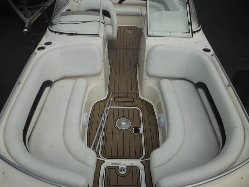 Slide: The Image of 2007 Hurricane SD 237 boat interior with white seating and wood-style flooring. - 47