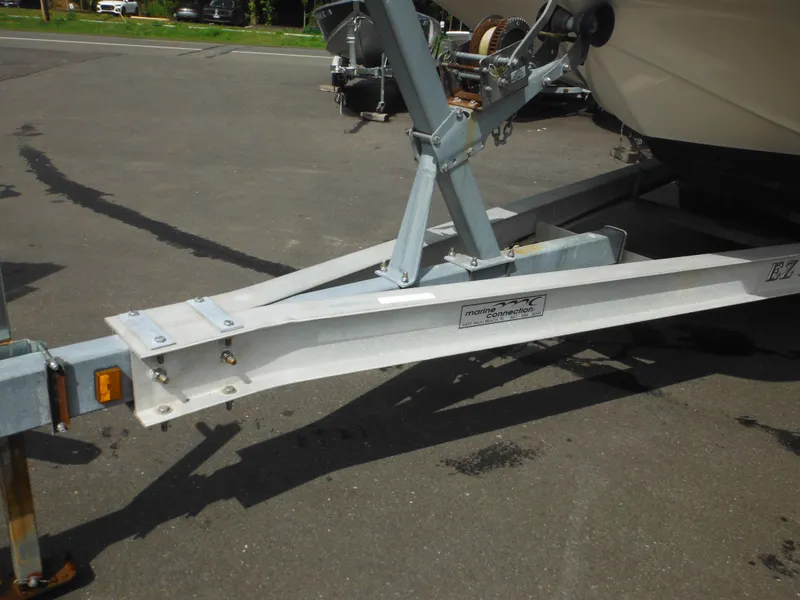 Slide: The Image of Trailer hitch of a 2007 Hurricane SD 237 boat on pavement. - 5