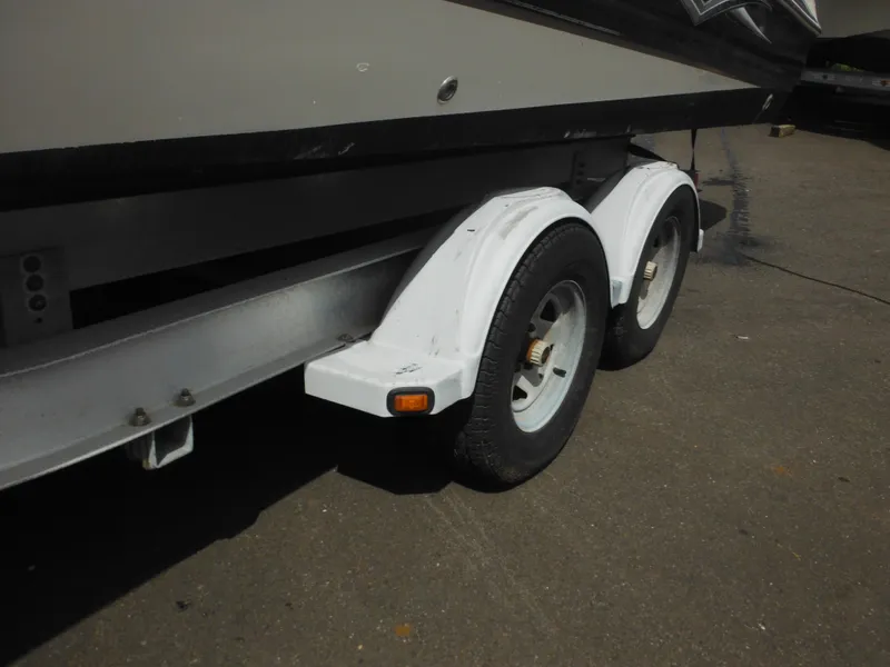 Slide: The Image of Trailer for 2007 Hurricane SD 237 boat with dual wheels on pavement. - 7