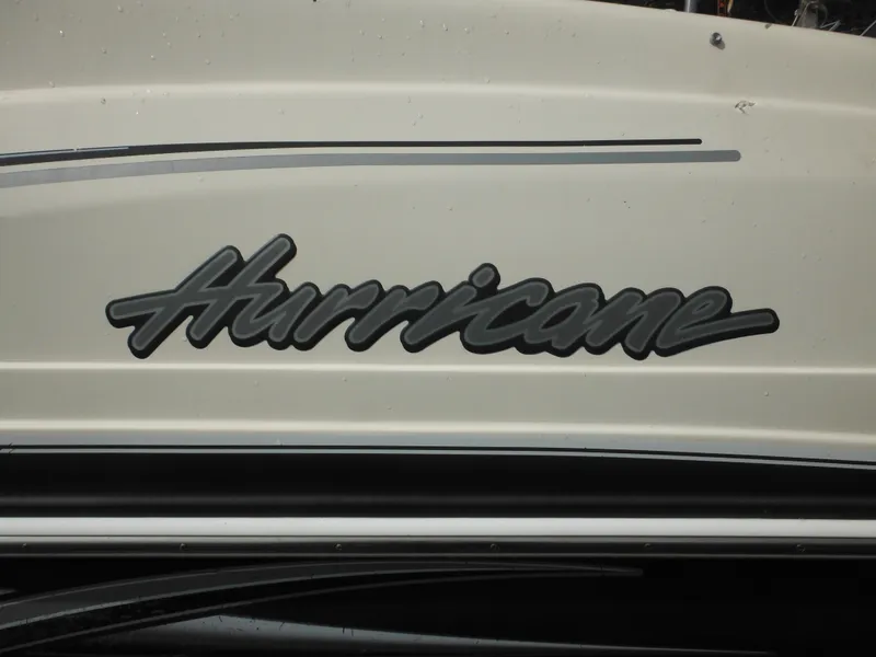 Slide: The Image of 2007 Hurricane SD 237 boat logo on white surface. - 9