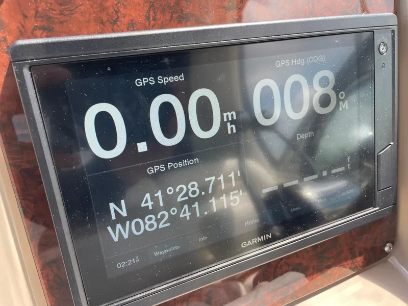 Slide: The Image of Garmin GPS display on 2004 Sea Ray 320 Sundancer showing speed and coordinates. - 3