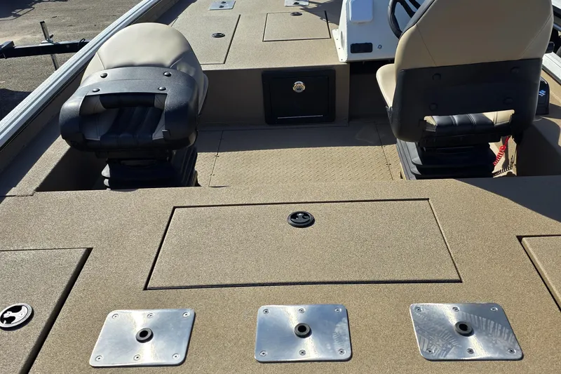 Slide: The Image of 2025 SeaArk Flex 19 boat interior with seating and storage compartments. - 6