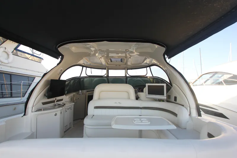Slide: The Image of 2007 Sea Ray 44 Sundancer yacht interior with white seating and modern amenities. - 17