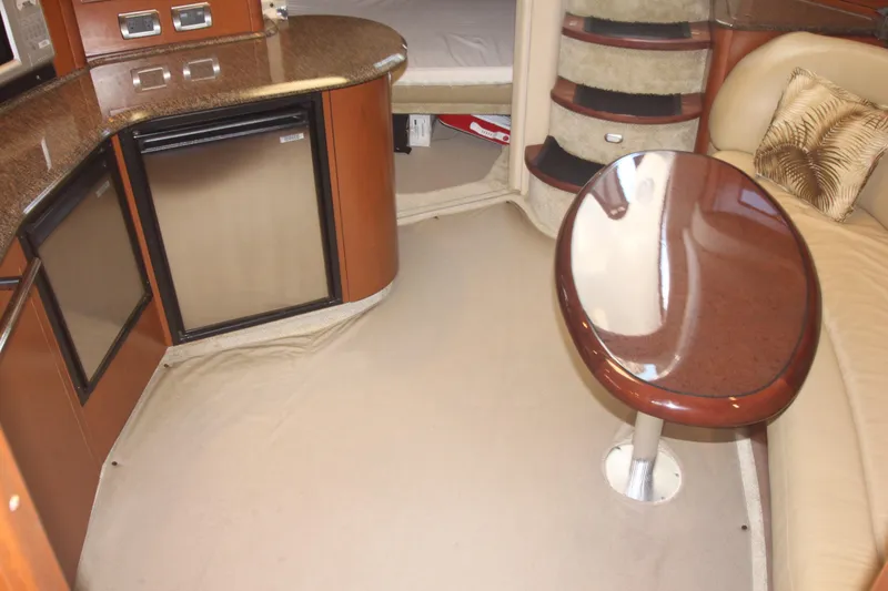 Slide: The Image of 2007 Sea Ray 44 Sundancer interior with kitchenette, table, and seating area. - 29