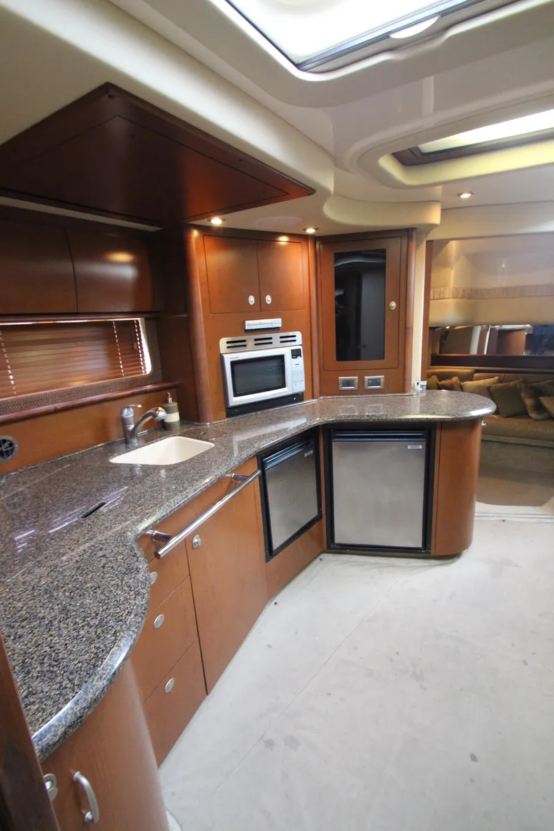 Slide: The Image of Luxurious kitchen interior of 2007 Sea Ray 44 Sundancer yacht with modern appliances. - 35