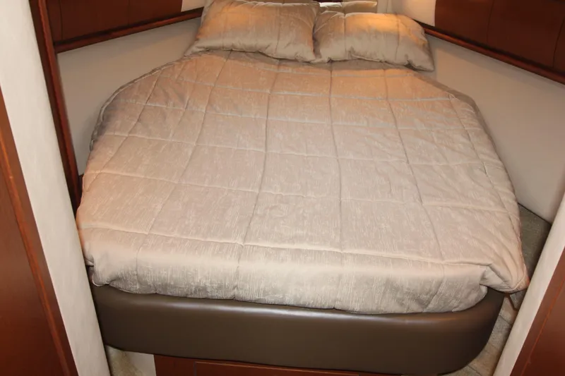 Slide: The Image of Cozy bedroom interior of 2007 Sea Ray 44 Sundancer yacht with beige bedding. - 37