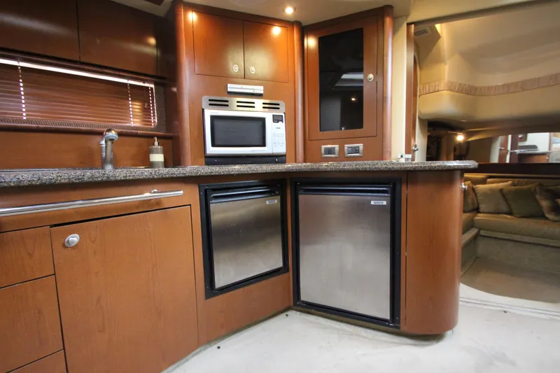 Slide: The Image of 2007 Sea Ray 44 Sundancer yacht interior with modern kitchen and stainless appliances. - 42