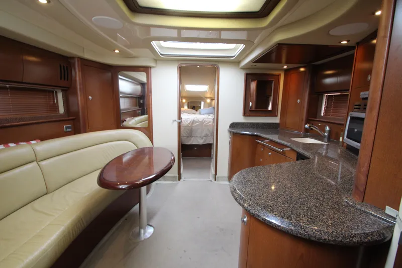 Slide: The Image of Luxurious interior of 2007 Sea Ray 44 Sundancer yacht with modern kitchen and seating area. - 43