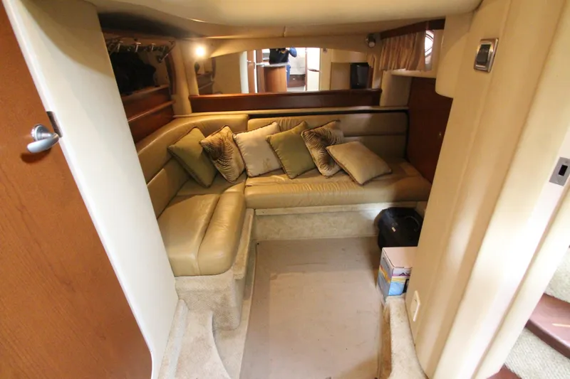 Slide: The Image of Interior of 2007 Sea Ray 44 Sundancer yacht with cozy seating area and cushions. - 45