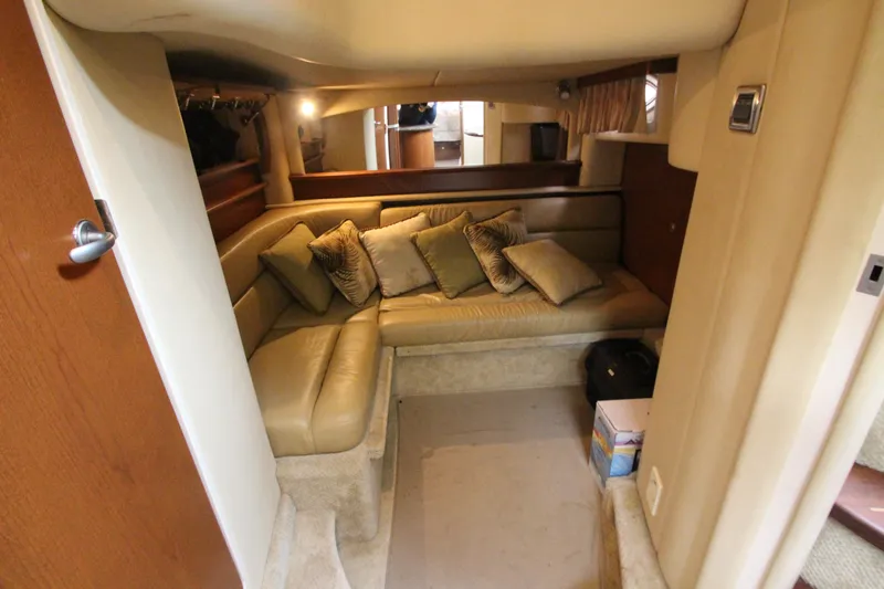 Slide: The Image of 2007 Sea Ray 44 Sundancer cabin with beige seating and decorative pillows. - 46