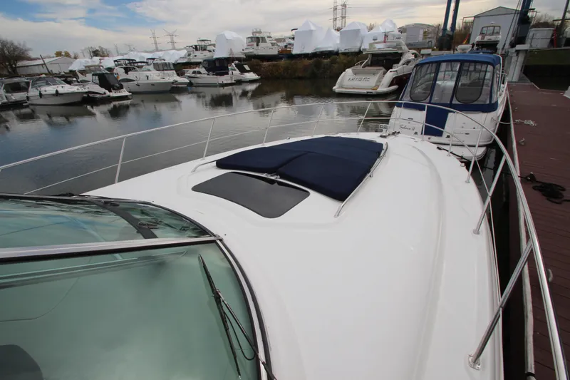 Slide: The Image of 2007 Sea Ray 44 Sundancer yacht docked at marina with other boats. - 9