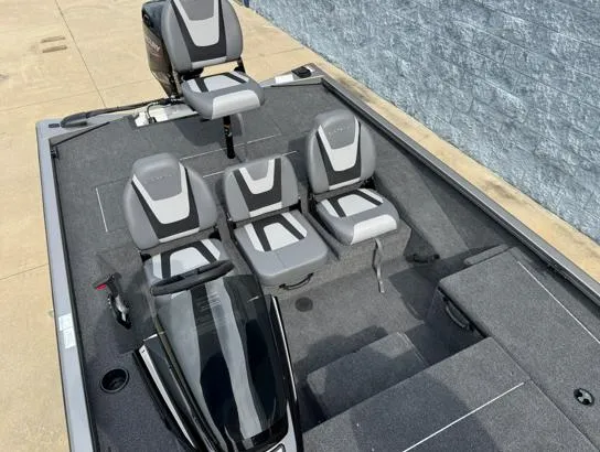Slide: The Image of 2025 Lowe Stinger ST175 boat interior with gray seating and modern design. - 4