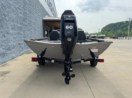 Slide: The Image of 2025 Lowe Stinger ST175 boat with Mercury 60 engine, parked outdoors. - 7