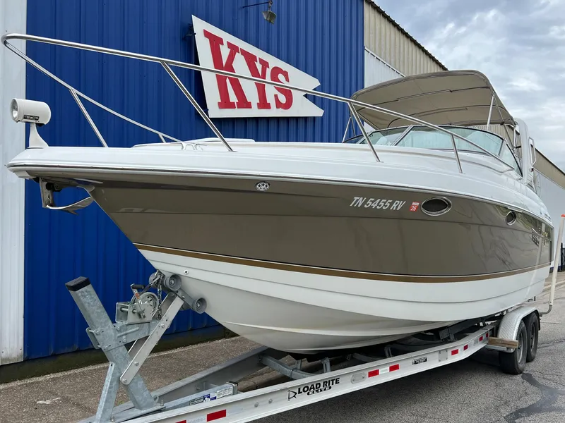 Slide: The Image of 2004 Formula 27 PC boat on trailer, parked outside KYS building. - 1