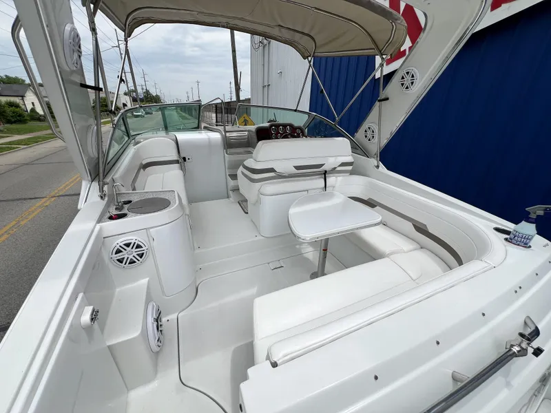 Slide: The Image of 2004 Formula 27 PC boat interior with seating, table, and canopy. - 10