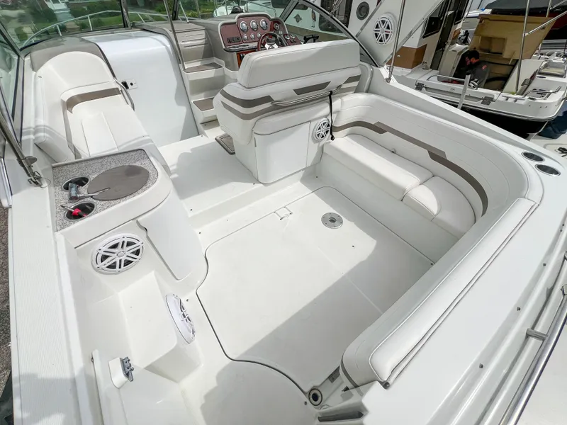 Slide: The Image of 2004 Formula 27 PC boat interior with white seating and dashboard. - 11
