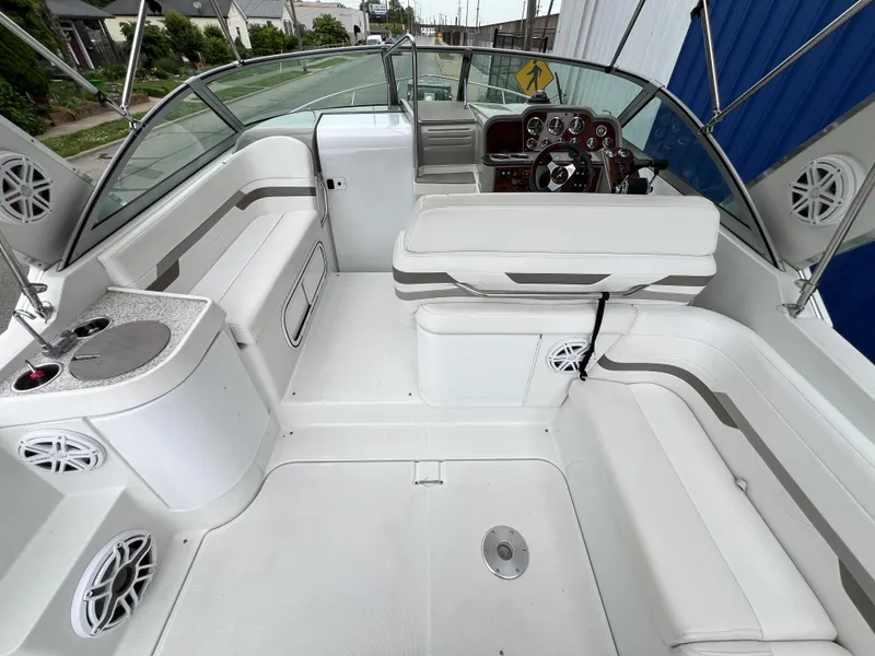 Slide: The Image of 2004 Formula 27 PC boat interior with white seating and control panel. - 13