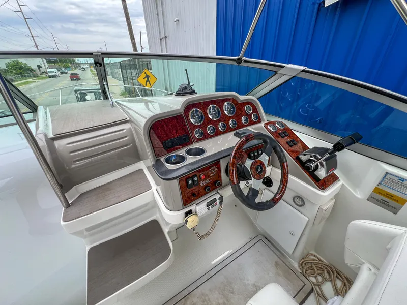 Slide: The Image of 2004 Formula 27 PC boat cockpit with steering wheel and control panel. - 20