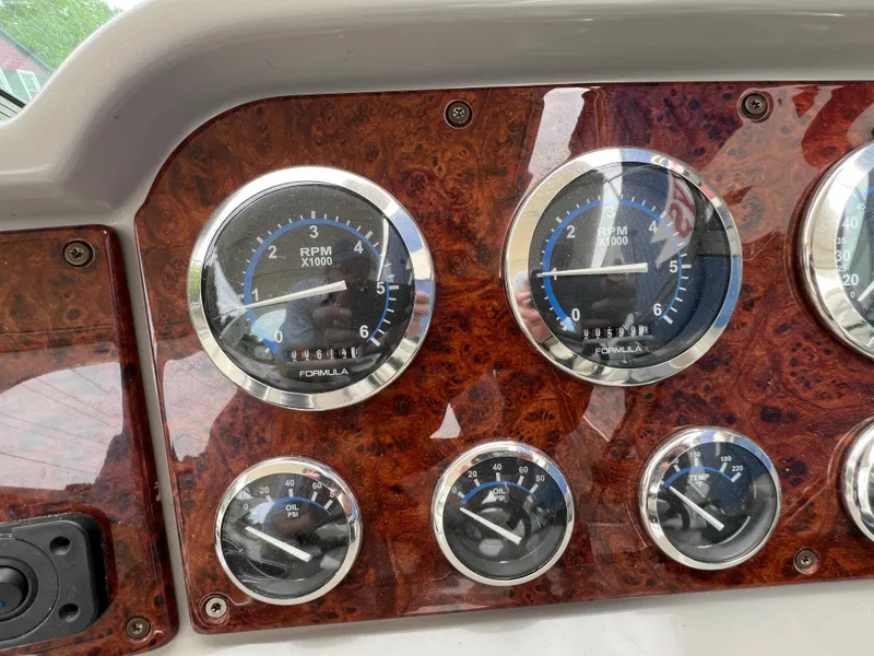 Slide: The Image of Dashboard of a 2004 Formula 27 PC boat with RPM and oil gauges. - 22