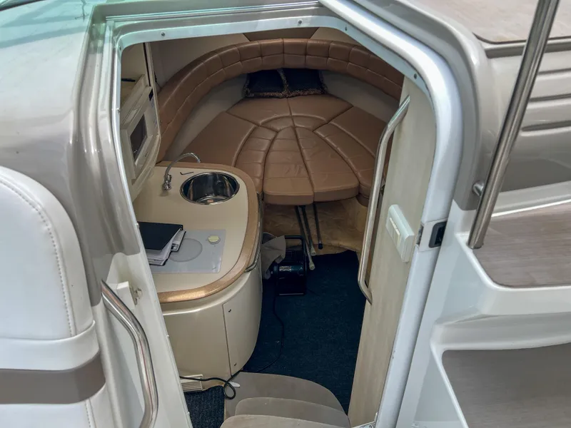Slide: The Image of 2004 Formula 27 PC cabin interior with kitchenette and seating area. - 24