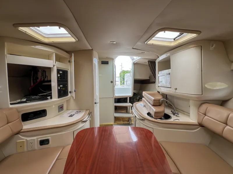 Slide: The Image of Interior of a 2004 Formula 27 PC boat with modern amenities and seating. - 30