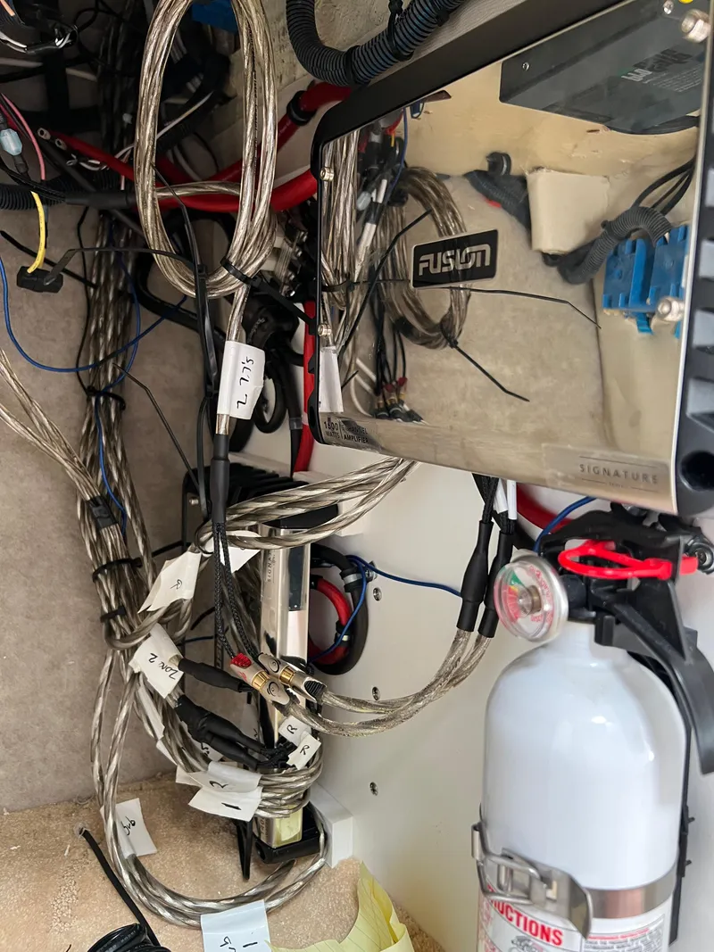 Slide: The Image of Electrical wiring and fire extinguisher inside a 2004 Formula 27 PC boat. - 37