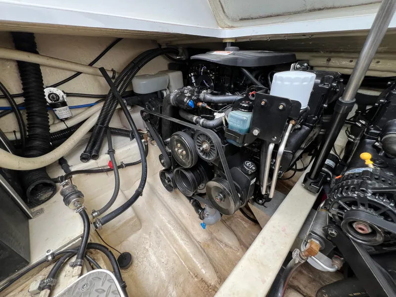 Slide: The Image of Engine compartment of a 2004 Formula 27 PC boat, showcasing detailed mechanical components. - 41