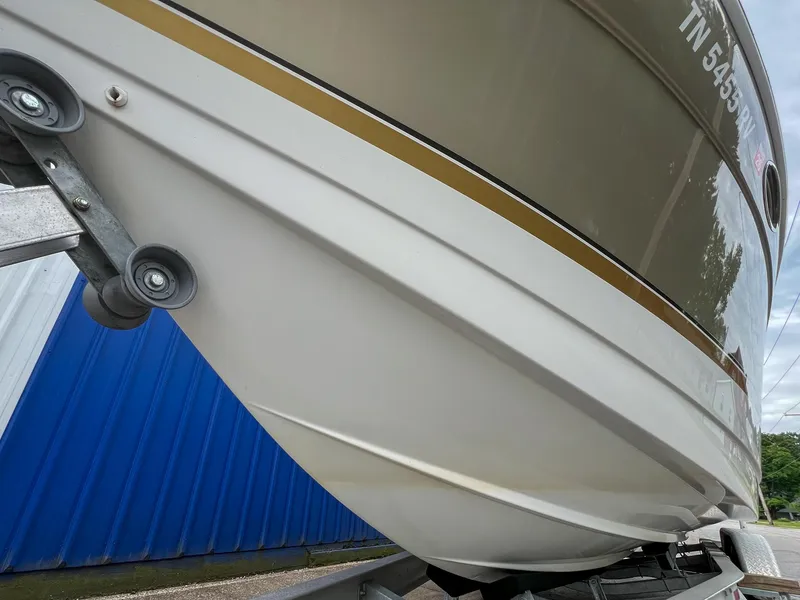 Slide: The Image of 2004 Formula 27 PC boat on trailer, close-up view of hull and registration number. - 7