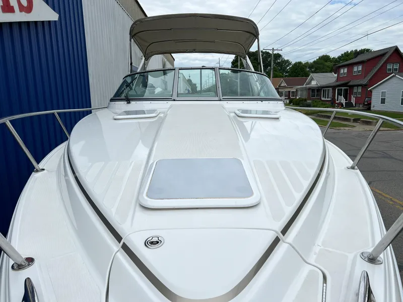 Slide: The Image of 2004 Formula 27 PC boat with canopy, docked near residential area. - 9