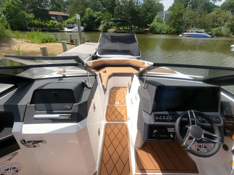 Slide: The Image of 2026 Cobalt R6 boat interior with modern dashboard and luxurious seating. - 17