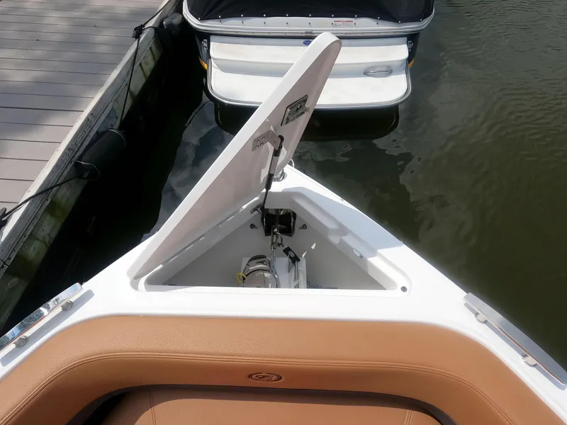 Slide: The Image of 2026 Cobalt R6 boat with open storage compartment at dock. - 19