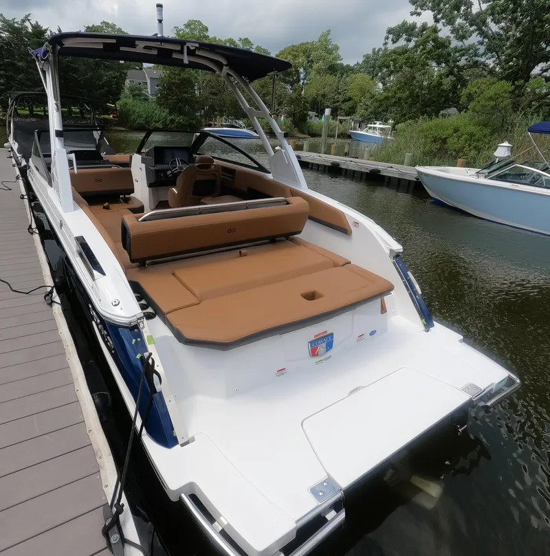 Slide: The Image of 2026 Cobalt R6 boat docked, featuring sleek design and spacious seating. - 4