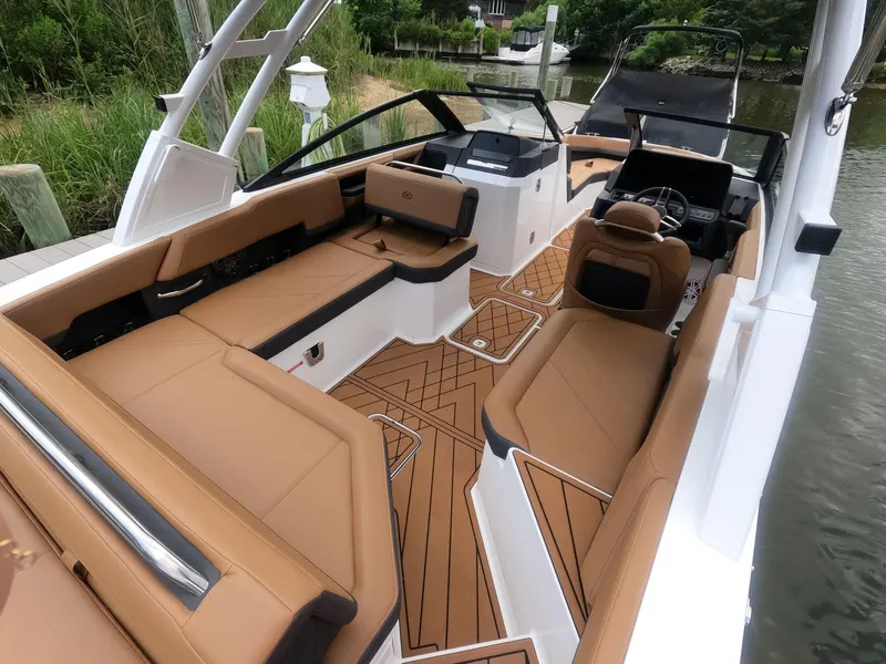 Slide: The Image of 2026 Cobalt R6 boat interior with tan seating and modern design. - 8