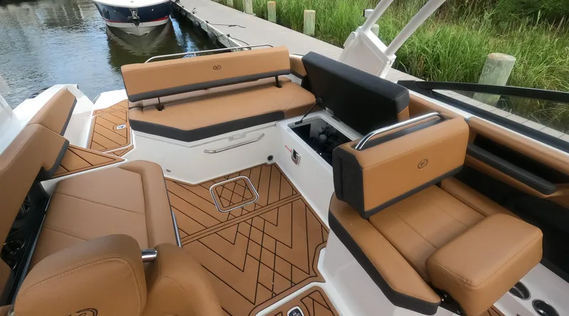 Slide: The Image of Luxurious interior of 2026 Cobalt R6 boat with tan leather seating and wood accents. - 9