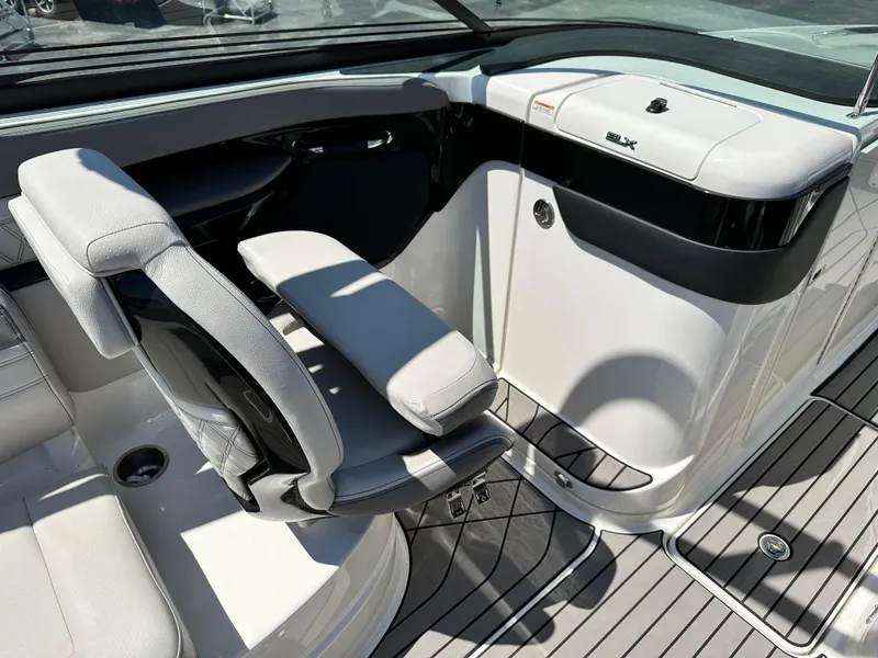 Slide: The Image of 2023 Sea Ray 260 SLX boat interior bathroom with toilet and sleek design. - 11