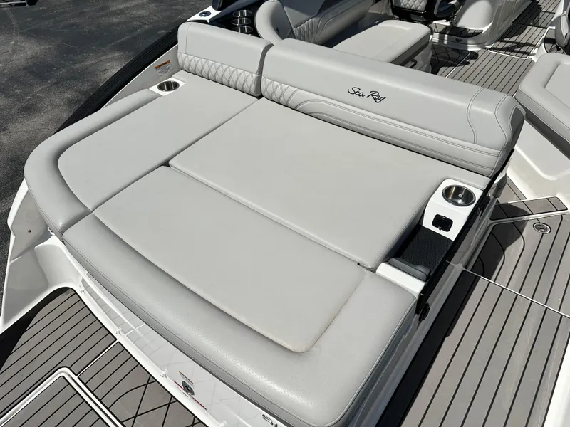 Slide: The Image of 2023 Sea Ray 260 SLX boat interior with luxurious seating and modern dashboard. - 7
