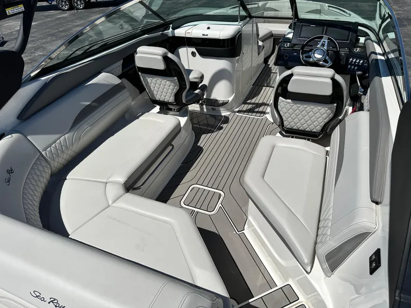 Slide: The Image of 2023 Sea Ray 260 SLX boat interior with modern steering and controls. - 8