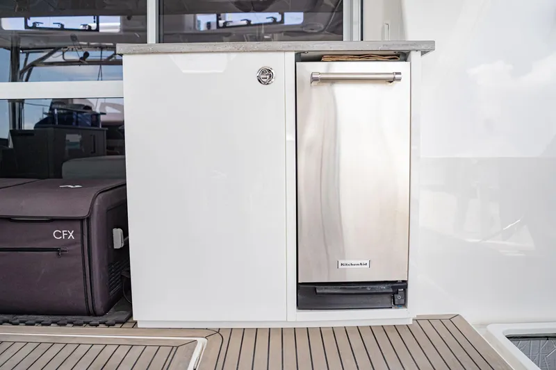 Slide: The Image of Cabinet and SS Trash Compactor - 63