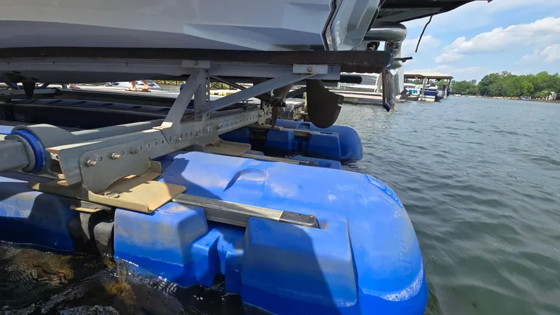 Slide: The Image of 2022 Correct Craft Super Air Nautique G23 on blue floating dock at lakeside. - 14