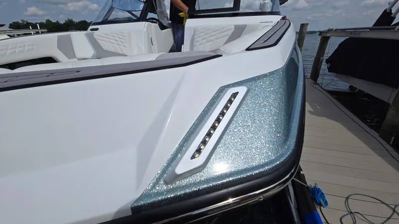 Slide: The Image of 2022 Correct Craft Super Air Nautique G23 boat with sleek design and modern detailing. - 20