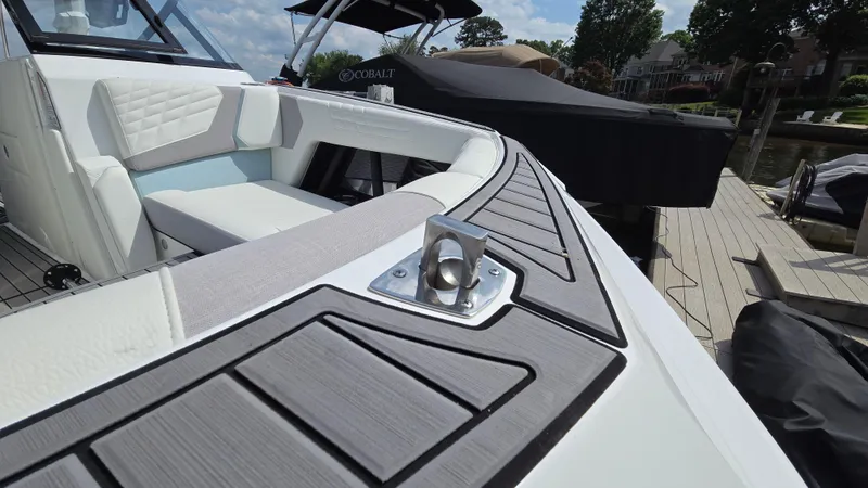 Slide: The Image of 2022 Correct Craft Super Air Nautique G23 boat with sleek seating and modern design. - 21