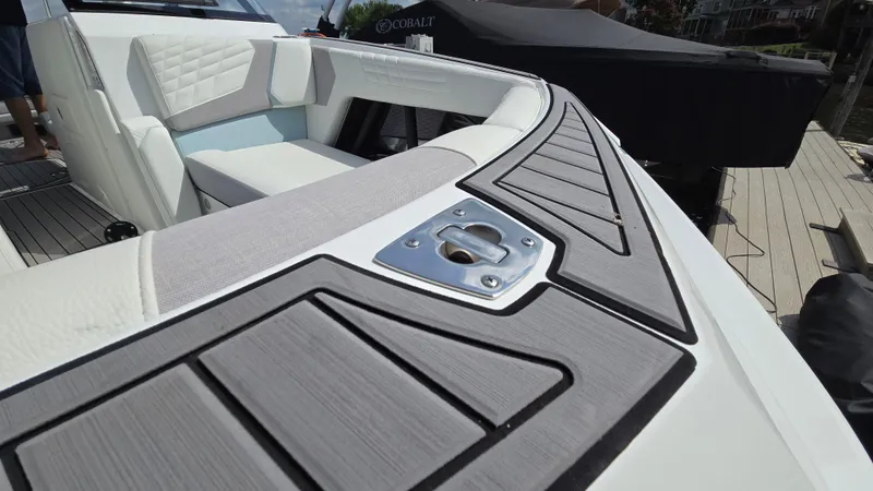 Slide: The Image of 2022 Correct Craft Super Air Nautique G23 boat interior with sleek seating and modern design. - 22