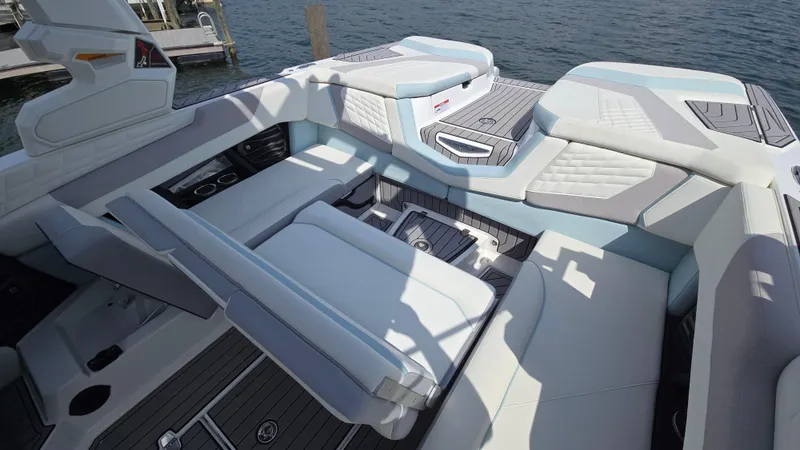 Slide: The Image of 2022 Correct Craft Super Air Nautique G23 interior with luxurious seating and modern design. - 26
