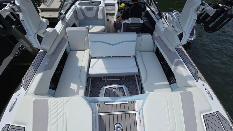 Slide: The Image of 2022 Correct Craft Super Air Nautique G23 interior with luxurious seating and modern design. - 27